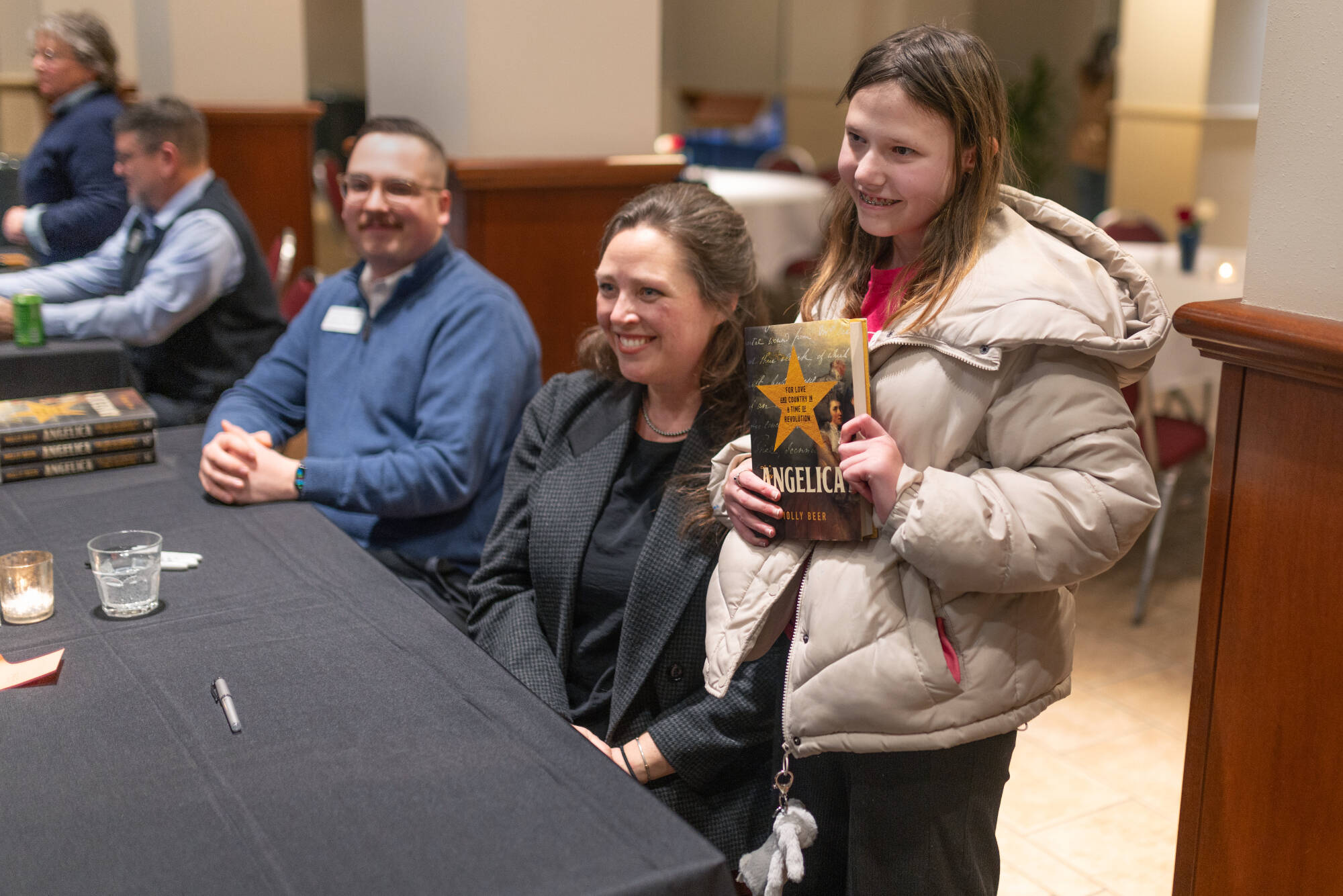 Student poses and smiles with guest speake Molly Beer